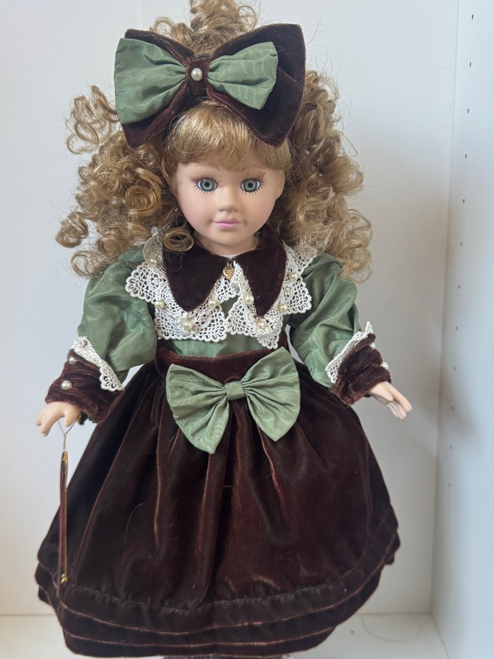 Porcelain Fashion Doll with Green & Brown Velvet Dress